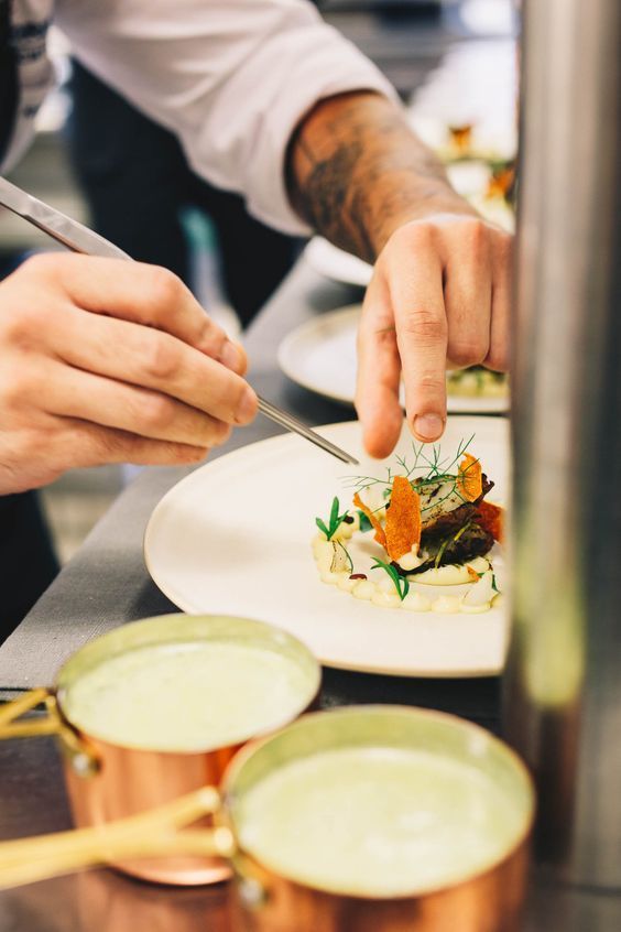 Private chef preparing gourmet meal in a villa
